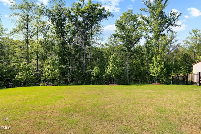 521 Marion Hills Way, Knightdale, NC 27545 - view of yard with fence and a view of trees