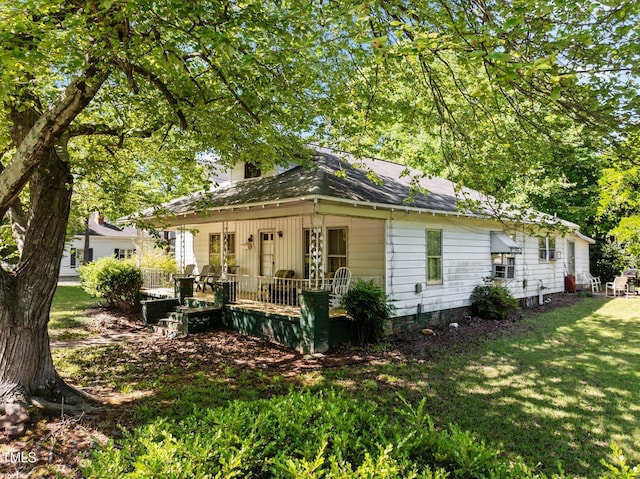 301 N W St, Cary, NC 27513 - exterior space with a lawn and roof with shingles