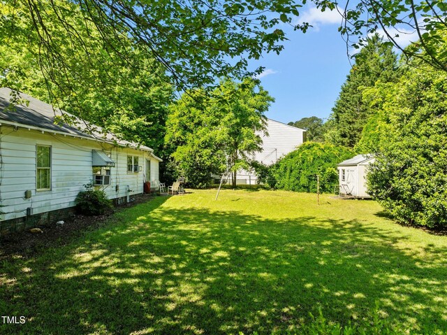 301 N W St, Cary, NC 27513 - view of yard featuring an outbuilding and a shed