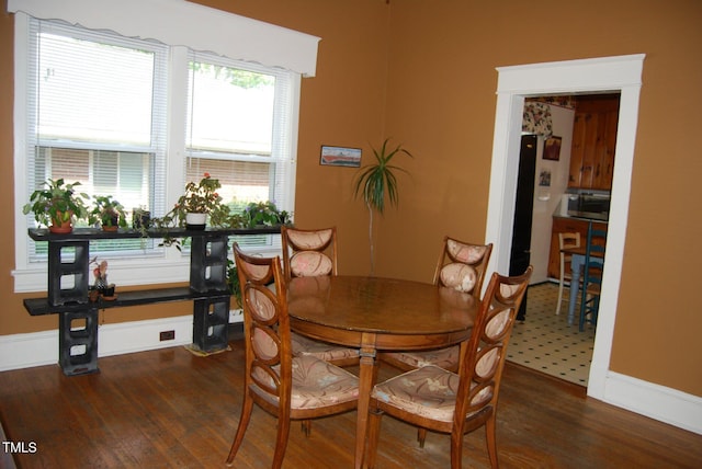 1013 Green St, Durham, NC 27701 - dining room with baseboards and wood finished floors