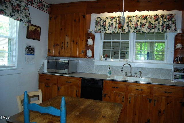1013 Green St, Durham, NC 27701 - kitchen with a sink, stainless steel microwave, brown cabinetry, and dishwasher