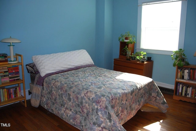 1013 Green St, Durham, NC 27701 - bedroom featuring baseboards and wood finished floors
