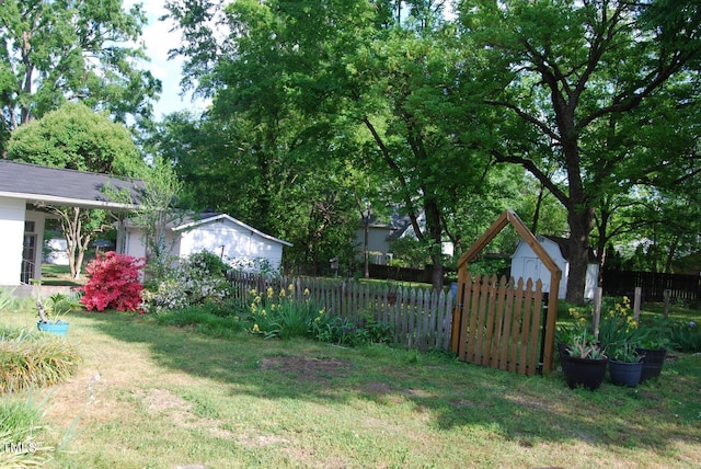 1013 Green St, Durham, NC 27701 - view of yard featuring an outdoor structure, fence private yard, and a storage unit