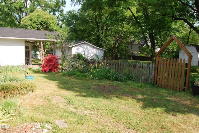 1013 Green St, Durham, NC 27701 - view of yard with fence, an outdoor structure, and a shed