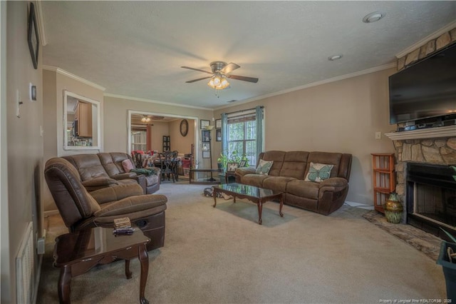 carpeted living room featuring crown molding, a ceiling fan, baseboards, and a fireplace