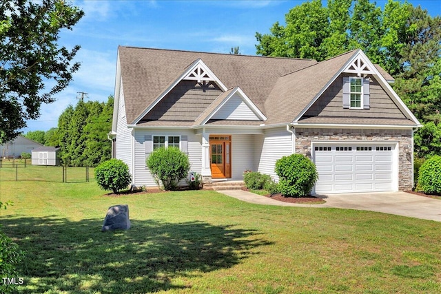 2062 Montgomery Dr, Franklinton, NC 27525 - craftsman-style home featuring driveway, stone siding, and a shingled roof