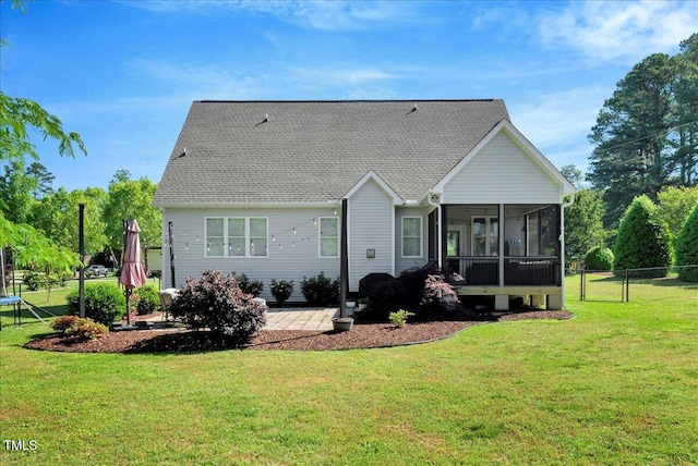 2062 Montgomery Dr, Franklinton, NC 27525 - rear view of property featuring a sunroom, a shingled roof, and a patio