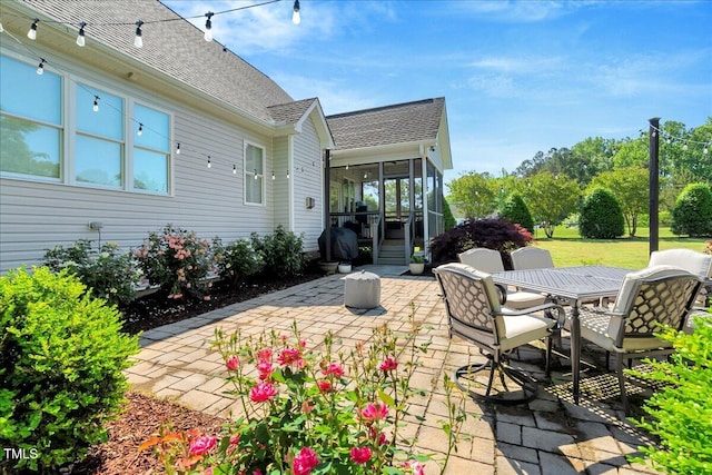 2062 Montgomery Dr, Franklinton, NC 27525 - view of patio with a sunroom and outdoor dining area