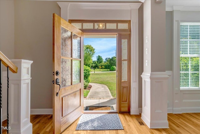 2062 Montgomery Dr, Franklinton, NC 27525 - foyer featuring light wood-type flooring, ornamental molding, and baseboards