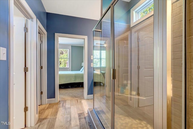 2062 Montgomery Dr, Franklinton, NC 27525 - ensuite bathroom featuring wood finished floors, a shower stall, and baseboards