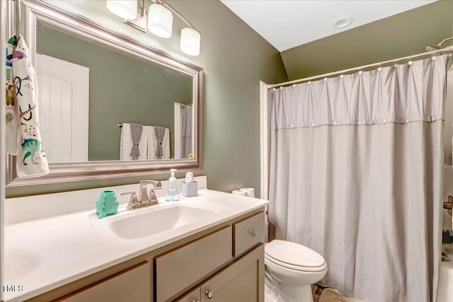2062 Montgomery Dr, Franklinton, NC 27525 - bathroom featuring vanity, toilet, a shower with curtain, and vaulted ceiling
