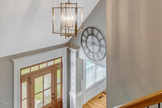 2062 Montgomery Dr, Franklinton, NC 27525 - foyer entrance with a chandelier and wood finished floors