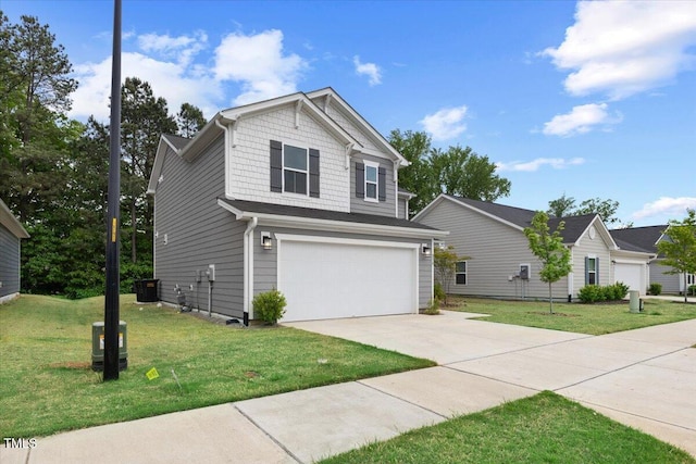 traditional-style house with a garage, a front lawn, central air condition unit, and concrete driveway