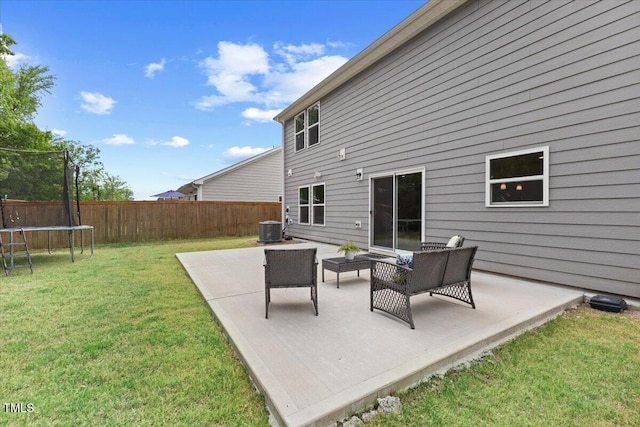 view of patio / terrace featuring central AC, a fenced backyard, a trampoline, and an outdoor hangout area