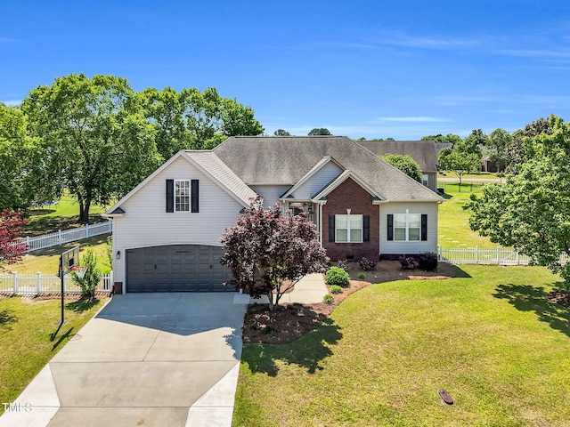 205 Carlyle Cir, Goldsboro, NC 27530 - traditional-style home featuring an attached garage, driveway, brick siding, and a shingled roof