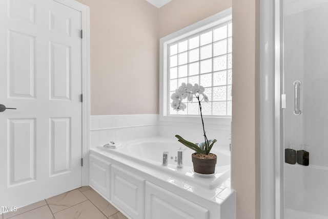 205 Carlyle Cir, Goldsboro, NC 27530 - full bath with marble look tiles, a shower stall, and a bath