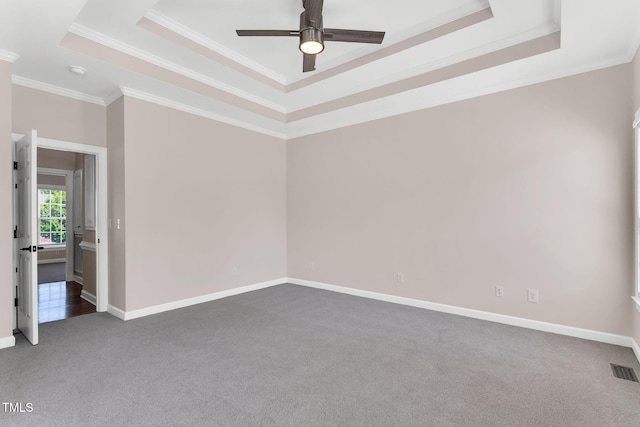 205 Carlyle Cir, Goldsboro, NC 27530 - unfurnished room with a tray ceiling, carpet floors, ornamental molding, a ceiling fan, and baseboards