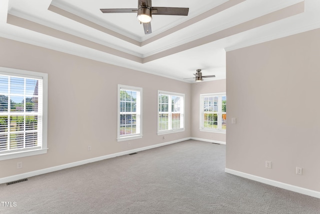 205 Carlyle Cir, Goldsboro, NC 27530 - unfurnished room featuring a tray ceiling, ornamental molding, a ceiling fan, carpet floors, and baseboards