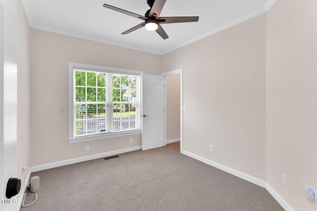 205 Carlyle Cir, Goldsboro, NC 27530 - carpeted empty room with ceiling fan, baseboards, and crown molding