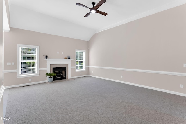 205 Carlyle Cir, Goldsboro, NC 27530 - unfurnished living room with ceiling fan, a fireplace with flush hearth, baseboards, lofted ceiling, and carpet
