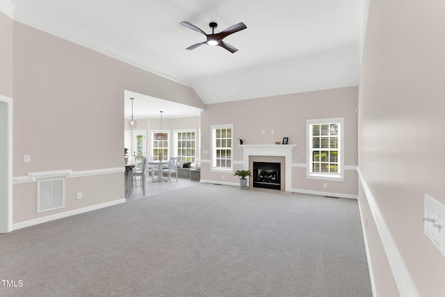 205 Carlyle Cir, Goldsboro, NC 27530 - unfurnished living room featuring a ceiling fan, vaulted ceiling, carpet flooring, baseboards, and ornamental molding