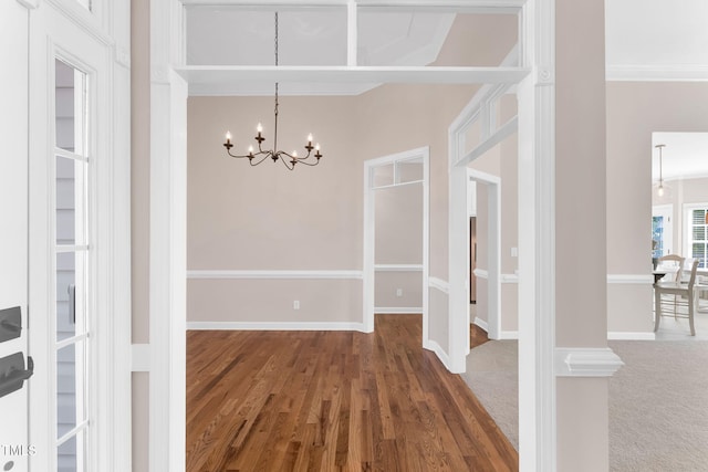 205 Carlyle Cir, Goldsboro, NC 27530 - unfurnished dining area with a chandelier, wood finished floors, baseboards, and crown molding