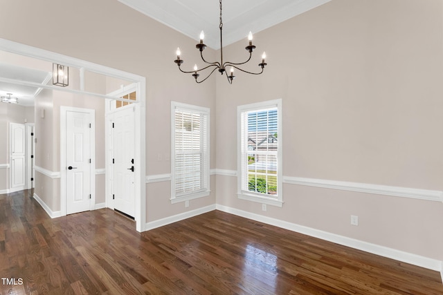 205 Carlyle Cir, Goldsboro, NC 27530 - unfurnished dining area with a chandelier, dark wood finished floors, and baseboards