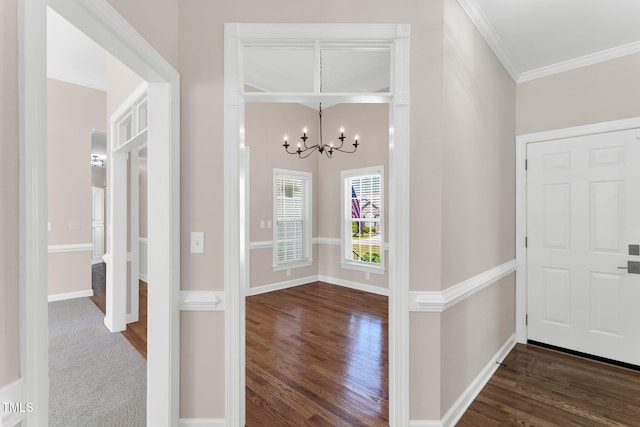 205 Carlyle Cir, Goldsboro, NC 27530 - foyer entrance featuring a chandelier, wood finished floors, crown molding, and baseboards
