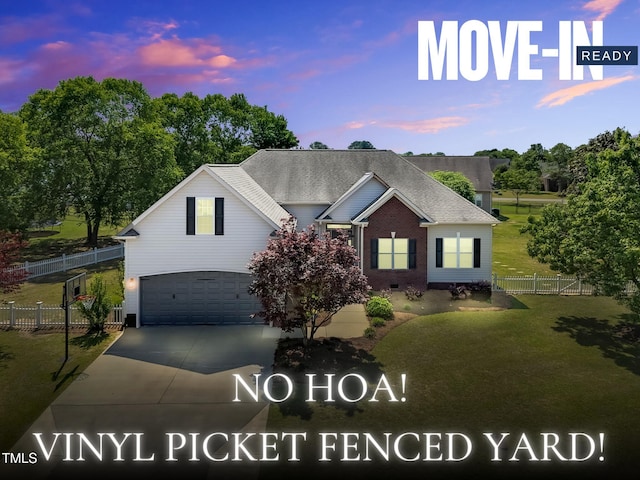 205 Carlyle Cir, Goldsboro, NC 27530 - view of front of property with a garage, concrete driveway, brick siding, and a shingled roof