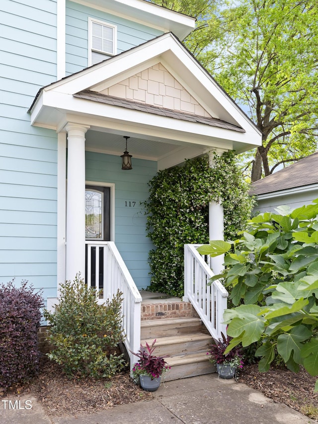 doorway to property featuring covered porch