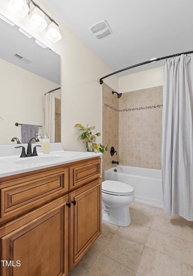 bathroom featuring shower / tub combo with curtain, vanity, toilet, tile patterned floors, and visible vents