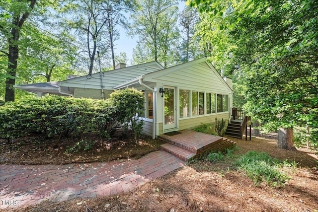 exterior space with a sunroom