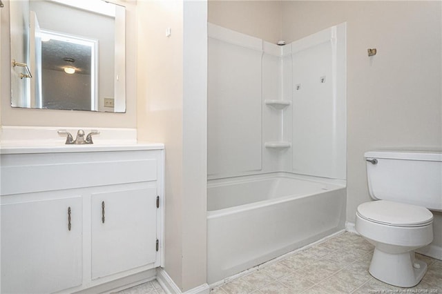full bathroom featuring toilet, baseboards, bathtub / shower combination, and vanity