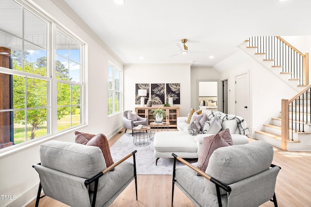 living room with stairs, wood finished floors, baseboards, ceiling fan, and recessed lighting