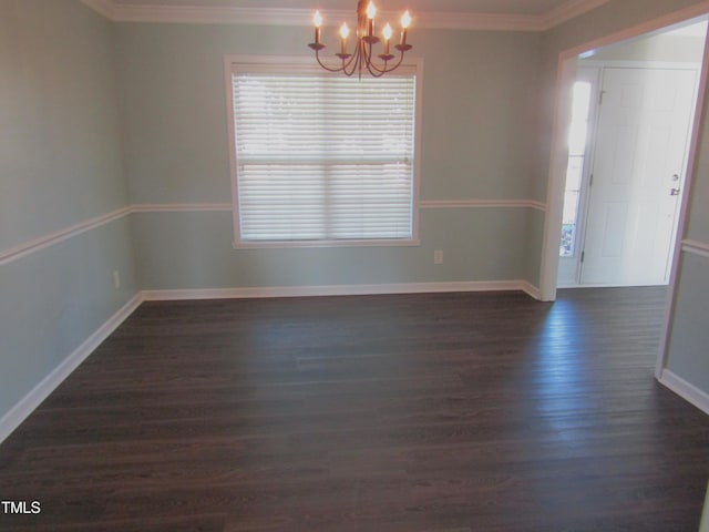 spare room featuring crown molding, baseboards, a notable chandelier, and dark wood-style floors