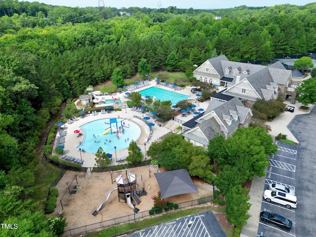 drone / aerial view featuring a view of trees