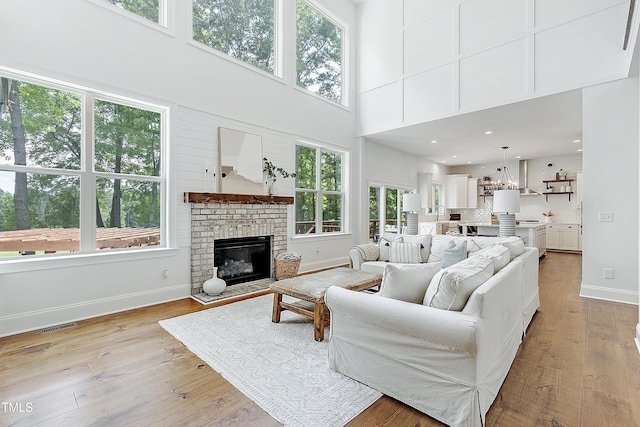 living room featuring plenty of natural light and a high ceiling