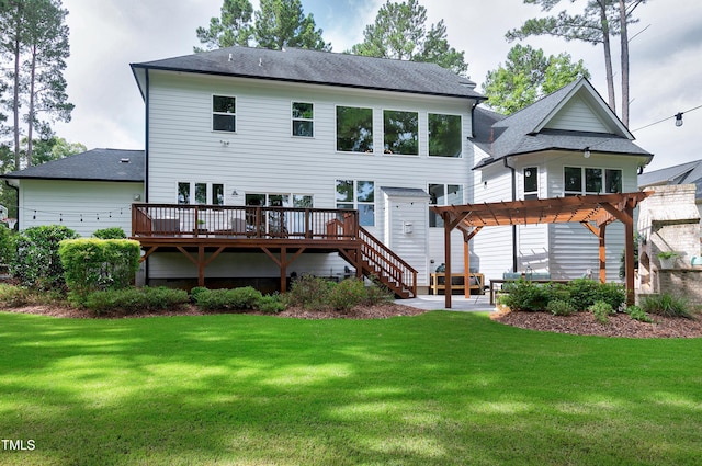 back of property featuring a lawn, a wooden deck, a patio, a pergola, and a shingled roof