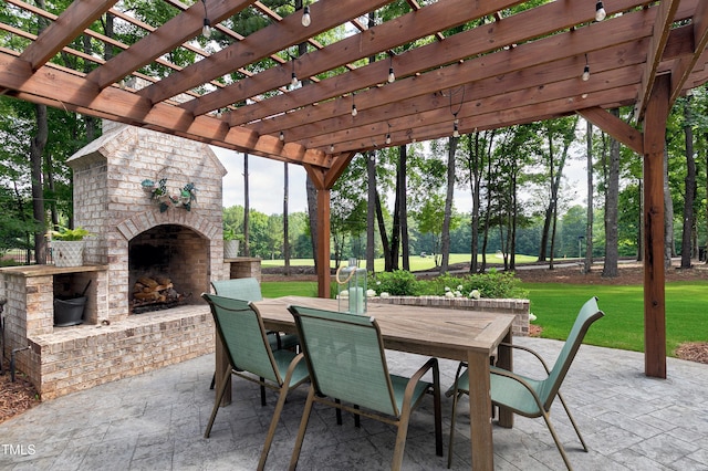 view of patio featuring an outdoor brick fireplace, outdoor dining area, and a pergola