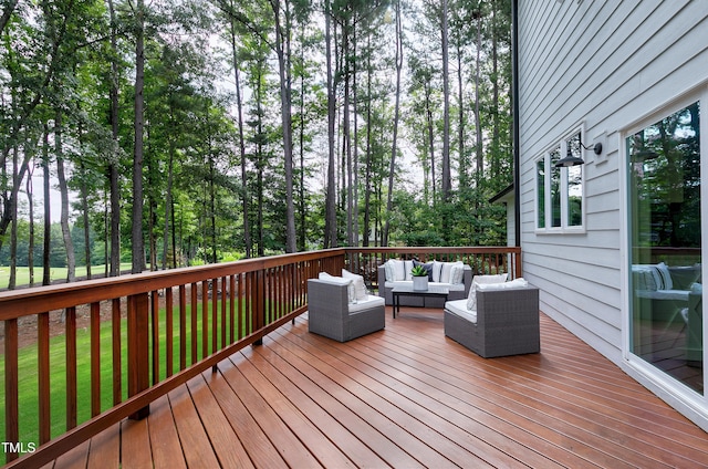 wooden deck with an outdoor living space