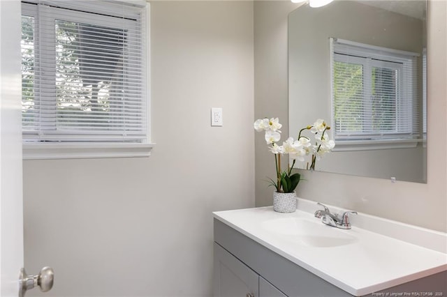 bathroom featuring vanity and a healthy amount of sunlight