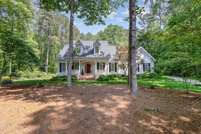 new england style home with a porch