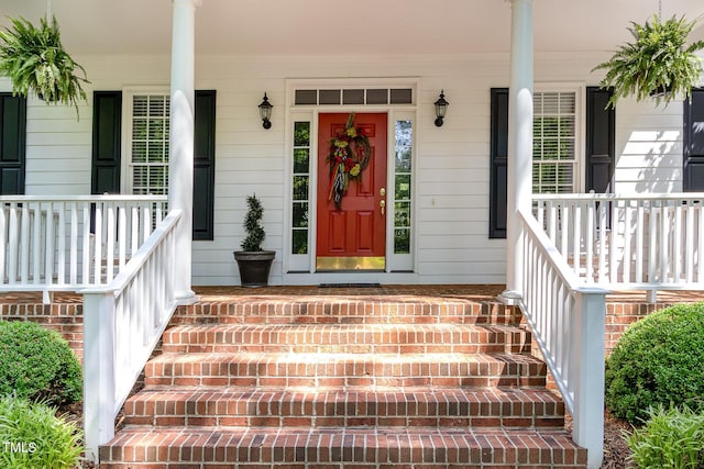 doorway to property featuring a porch