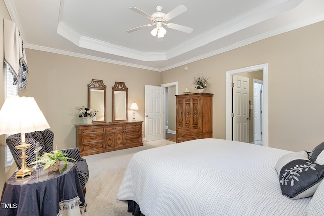 bedroom with crown molding, a raised ceiling, ceiling fan, and light carpet