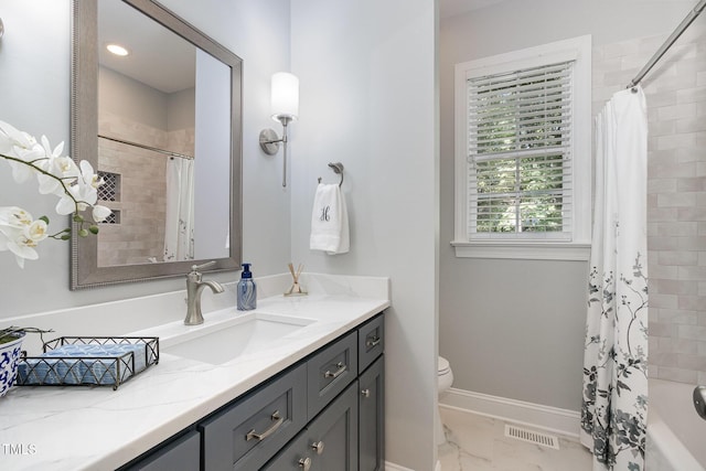 full bath featuring visible vents, vanity, baseboards, toilet, and marble finish floor