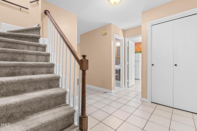 3029 Wycliff Rd, Raleigh, NC 27607 - staircase featuring baseboards and tile patterned floors