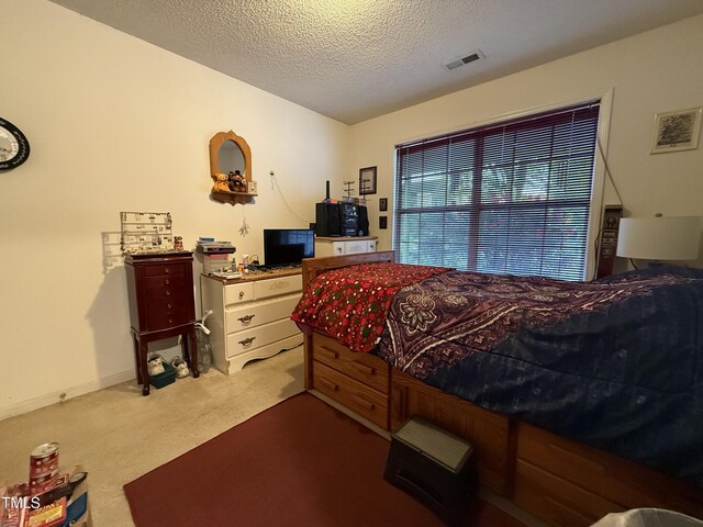1454-17 Cimarron Pkwy, Wake Forest, NC 27587 - bedroom with carpet floors, a textured ceiling, and visible vents