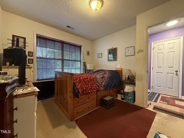 1454-17 Cimarron Pkwy, Wake Forest, NC 27587 - bedroom with light carpet, a textured ceiling, and visible vents