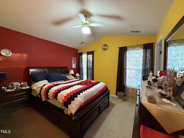 1454-17 Cimarron Pkwy, Wake Forest, NC 27587 - bedroom with a textured ceiling, visible vents, vaulted ceiling, baseboards, and light carpet