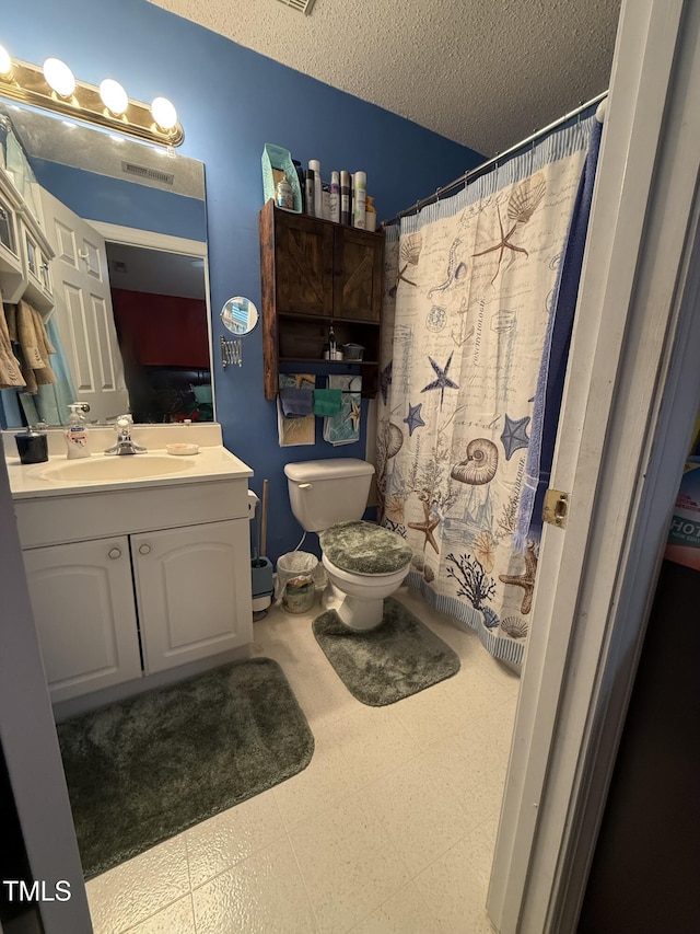 1454-17 Cimarron Pkwy, Wake Forest, NC 27587 - full bath featuring vanity, toilet, tile patterned floors, a textured ceiling, and curtained shower